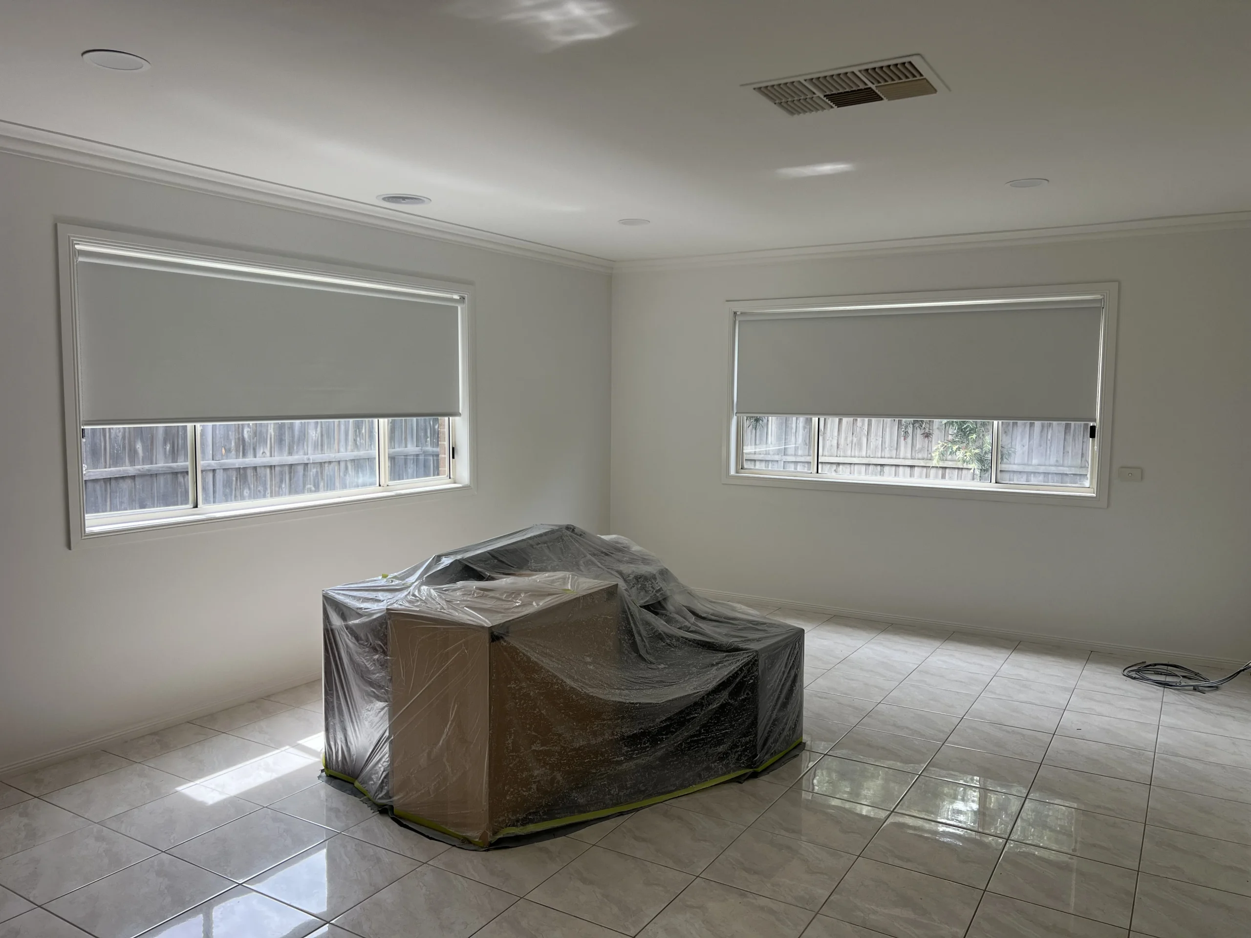 blockout roller blinds installed Melbourne bedroom charcoal dark