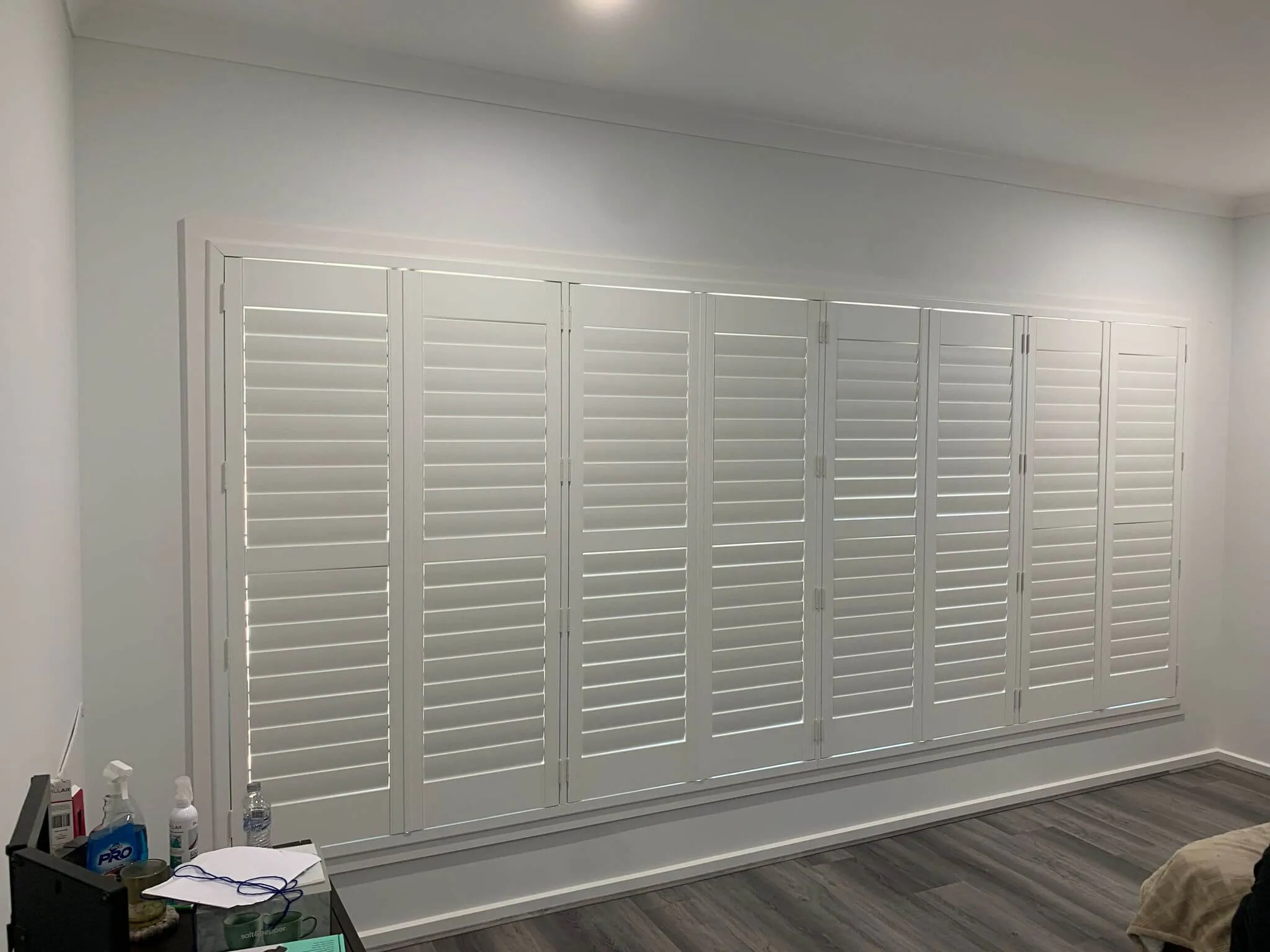 timber plantation shutters Melbourne bedroom warm wood louvres
